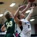 Pioneer High School senior William Kirchen reaches for a rebound in the game against Huron on Friday, Jan. 18. Pioneer leads at halftime 36-24. Daniel Brenner I AnnArbor.com